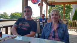 Mike, 66, and Elaine Foley, 67 sitting at a resturant.