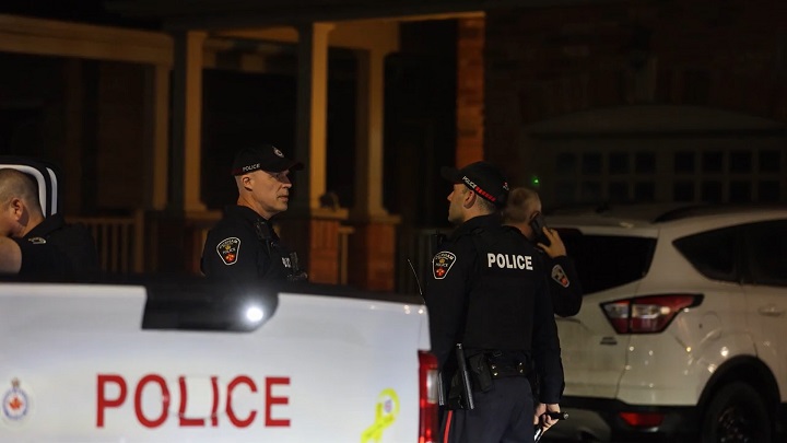 Officers at the scene of the stabbing in Oshawa.