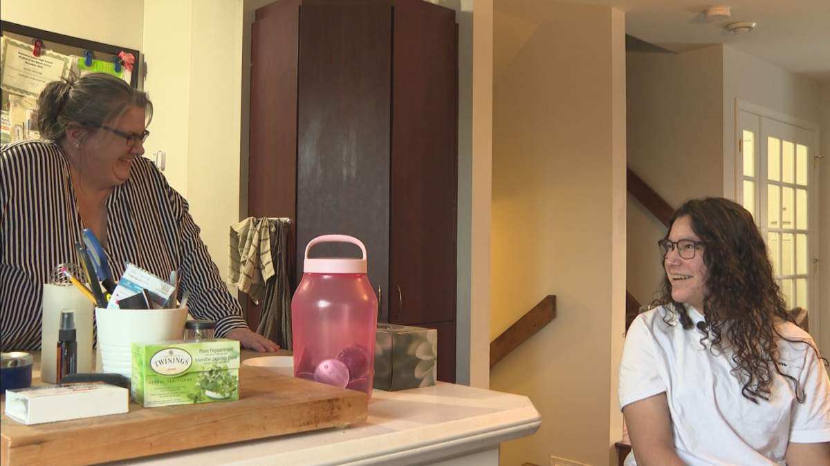 Edith Liard and her daughter Jasmine Fahoume speak in their home on Feb. 13, 2023.