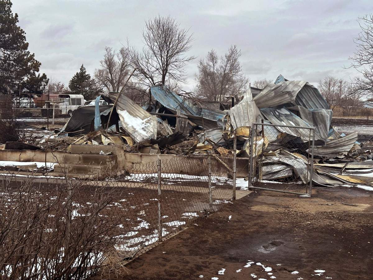 Snow covers a home that was destroyed by the Smokehouse Creek fire in Stinnett, Texas on Thursday, Feb. 29, 2024. The wildfire spreading across the Texas Panhandle became the largest in state history Thursday, as a dusting of snow covered scorched grassland, dead cattle and burned out homes and gave firefighters a brief window of relief in desperate efforts to corral the blaze.(AP Photo/Ty O’Neil)