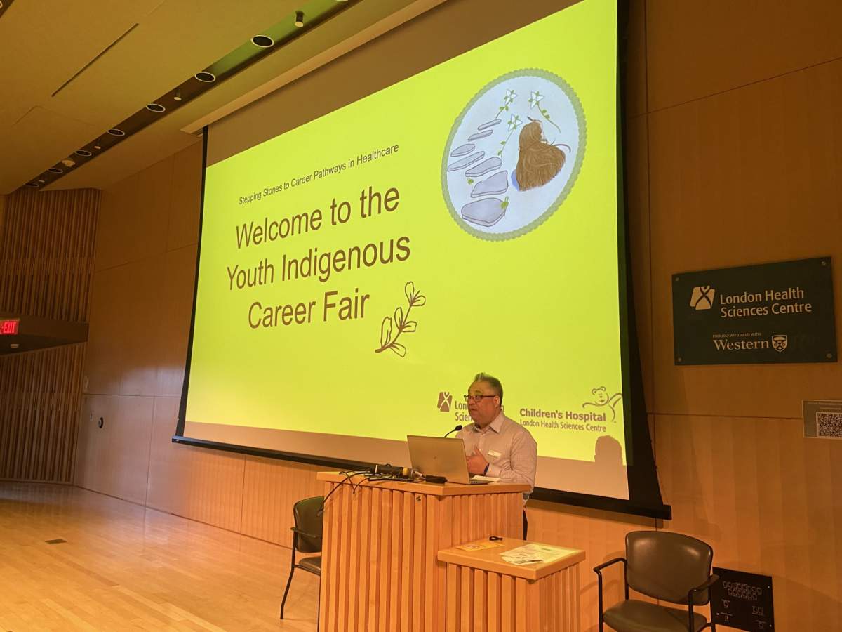 Nash Syed, president of Children's Hospital, presenting before he career fair.