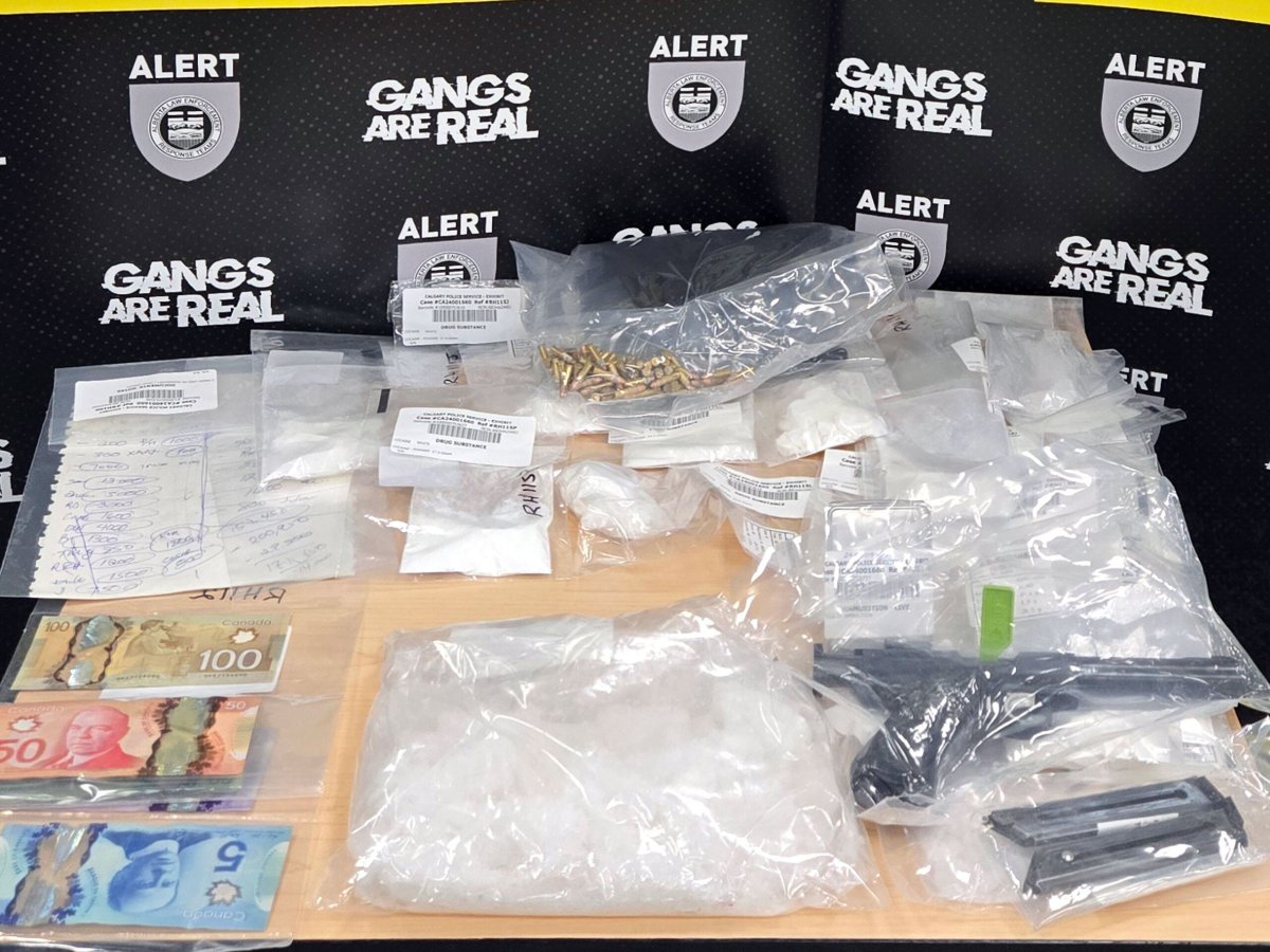 Drugs, cash and a firearm is displayed by ALERT in this undated photo following an organized crime investigation in Calgary and Cochrane.
