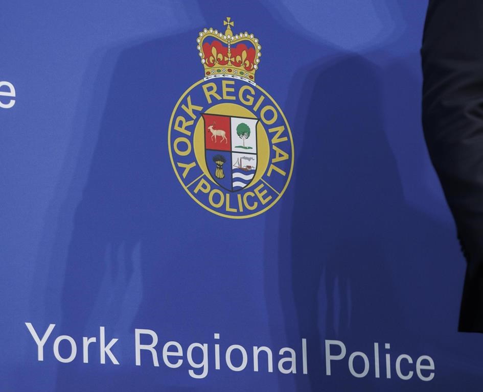 Signage is shown during a press conference at the York Regional Police Headquarters in Aurora, Ont., Wednesday, Jan. 31, 2024. York police say a man has been charged after allegedly firing a nail gun near protesers in Vaughan on Sunday. THE CANADIAN PRESS/Cole Burston.