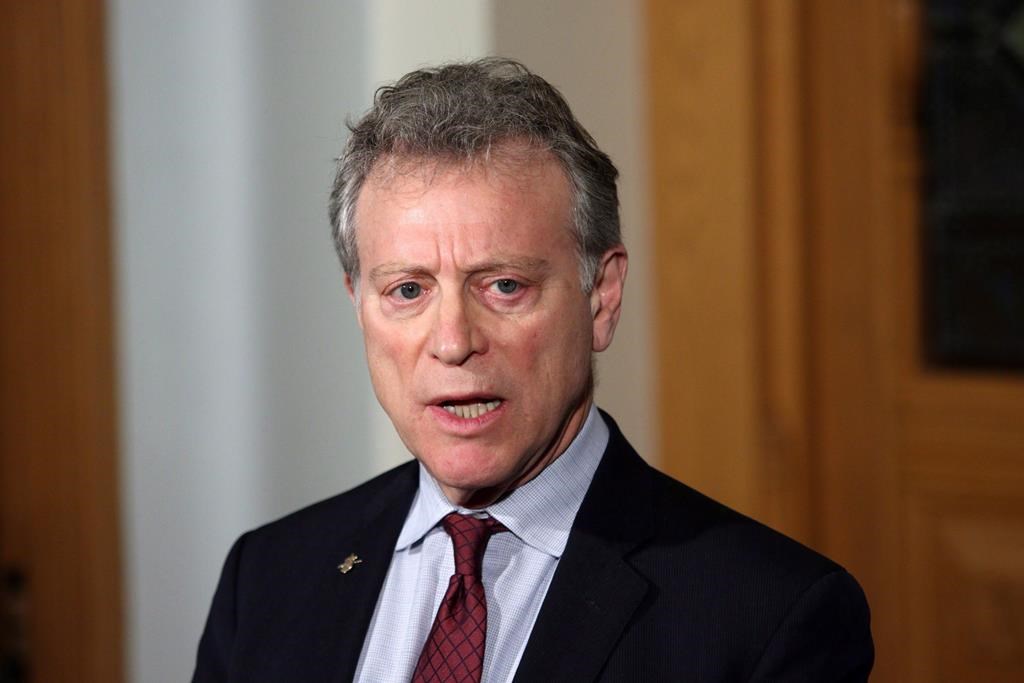 Minister of Environment and Climate Change Strategy George Heyman answers questions during a press conference at the legislature in Victoria, B.C., on Wednesday, Feb. 7, 2018. Heyman says he's decided not to run in this fall's provincial election. THE CANADIAN PRESS/Chad Hipolito.