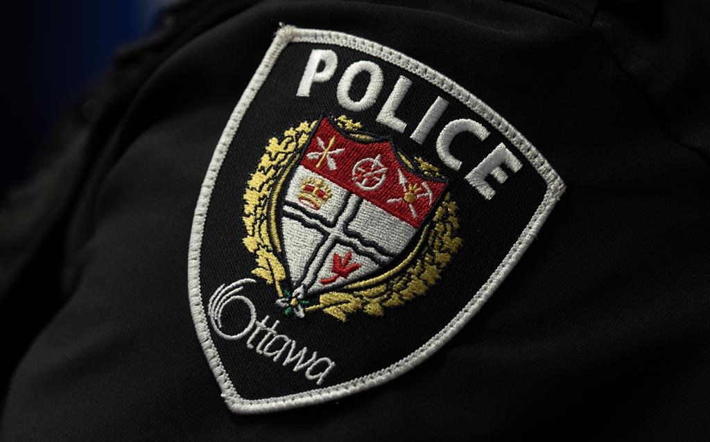 An arm patch is seen on an Ottawa Police Service officer during a news conference, in Ottawa, Wednesday, Sept. 6, 2023. THE CANADIAN PRESS/Adrian Wyld.