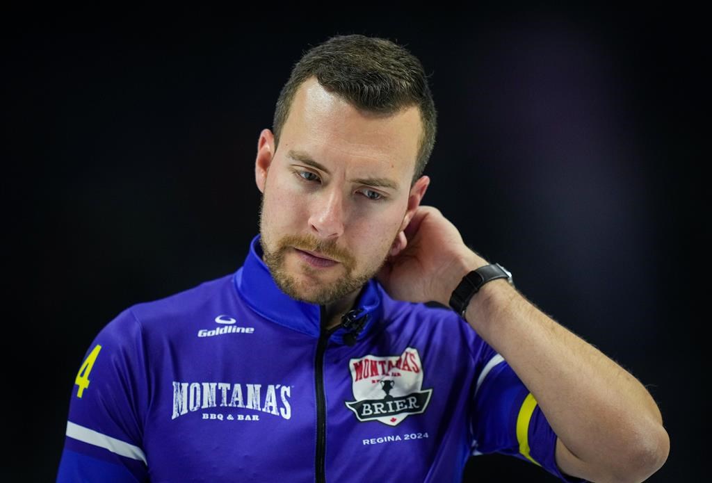 Alberta-Bottcher skip Brendan Bottcher reacts to his shot in the 8th end of a 7-3 loss to Saskatchewan during the semifinal at the Brier, in Regina, on Sunday, March 10, 2024. THE CANADIAN PRESS/Darryl Dyck.