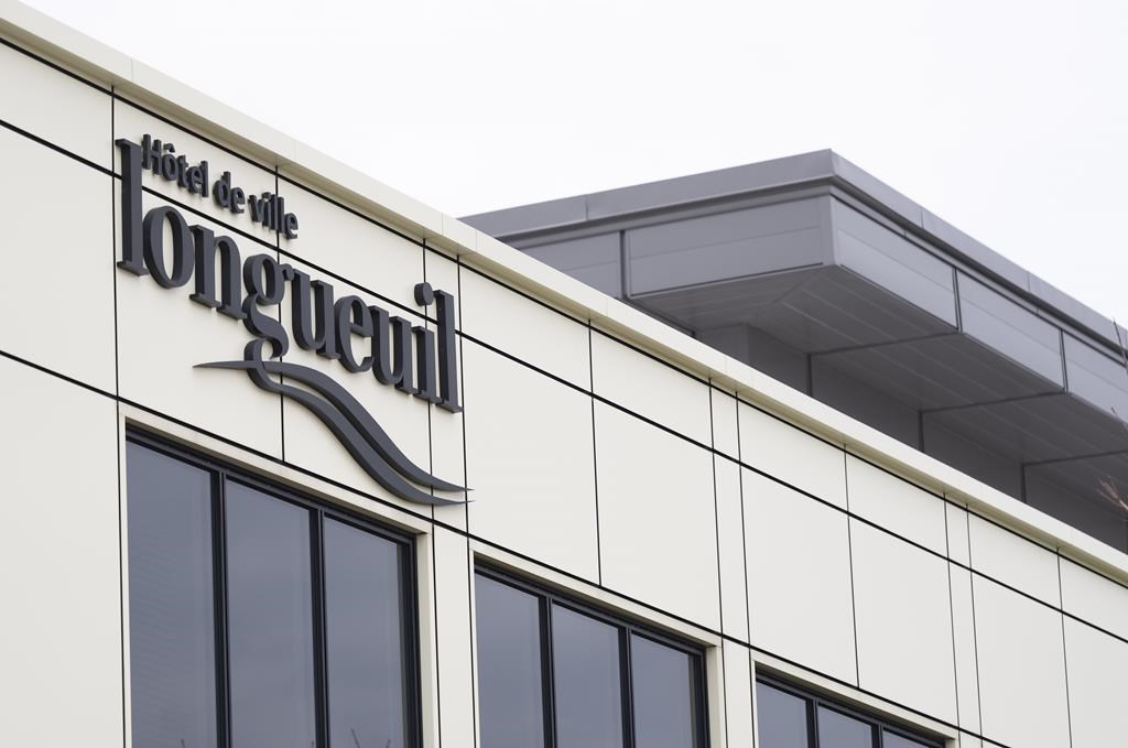 A sign shows city hall in Longueuil, Que.