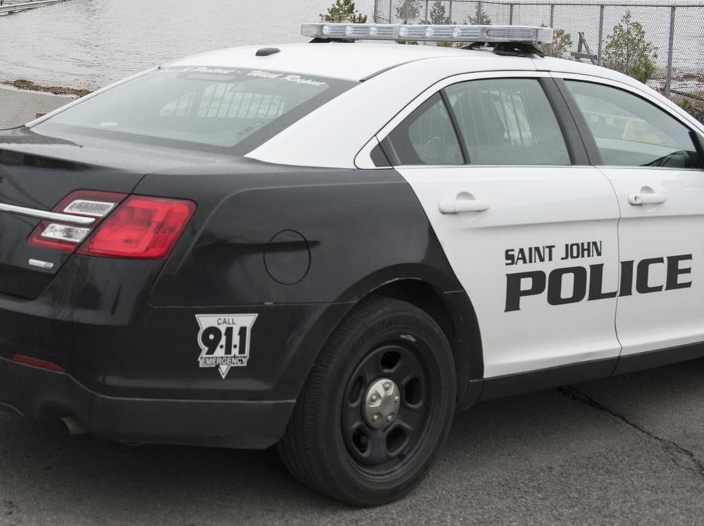 Saint John Police cruiser parked on side of road.