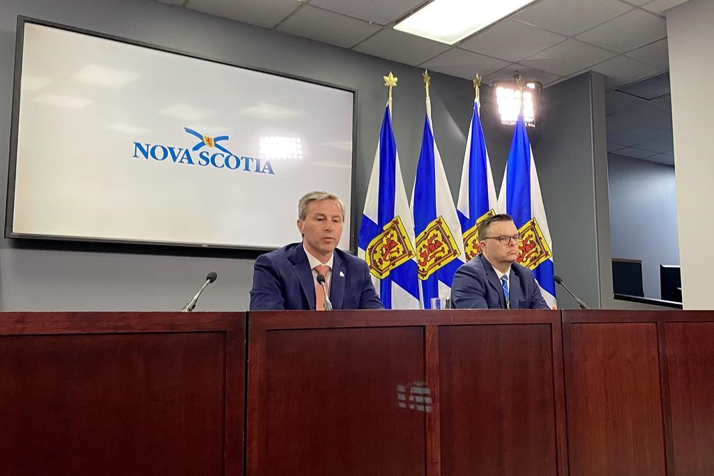 NS Community Services Minister Brendan Maguire and Premier Tim Houston, left, take part in a press conference in Halifax, Thursday, Feb. 22, 2024. The Nova Scotia government has announced it is indexing income assistance rates based on the consumer price index. THE CANADIAN PRESS/Keith Doucette.