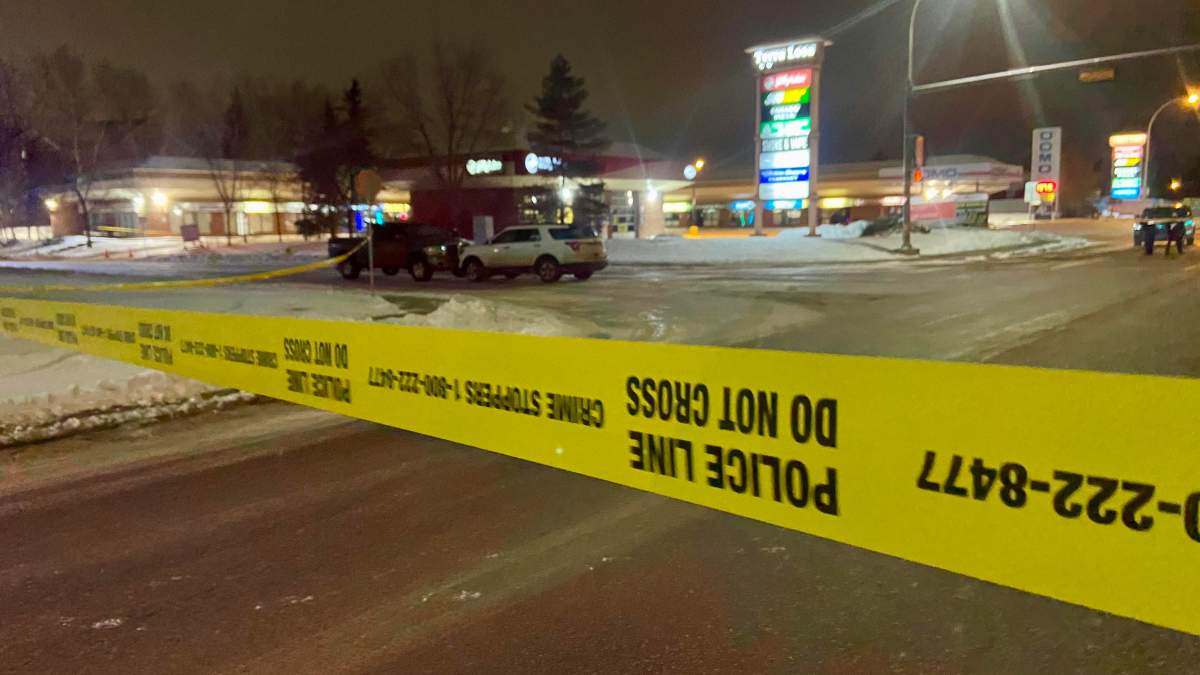 Two vehicles on 98A Avenue near 178 Street behind police tape in west Edmonton on Friday, March 1, 2024.