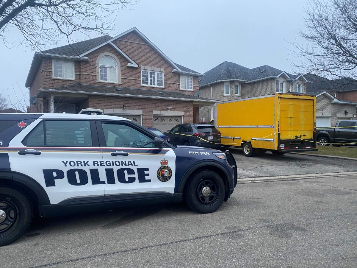 Police outside of a Woodbridge, Ont. home on March 6, 2024.