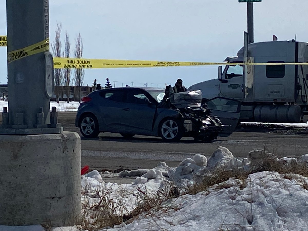 A damaged car is seen at the corner of 84th Street and 61st Avenue in Calgary, on March 27, 2024.