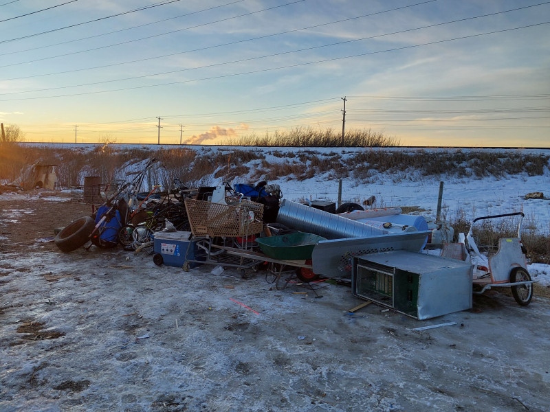 Calgary Police say sports equipment, clothing, bedding and furniture were among the items found in a homeless encampment in the Starfield Industrial Area.
