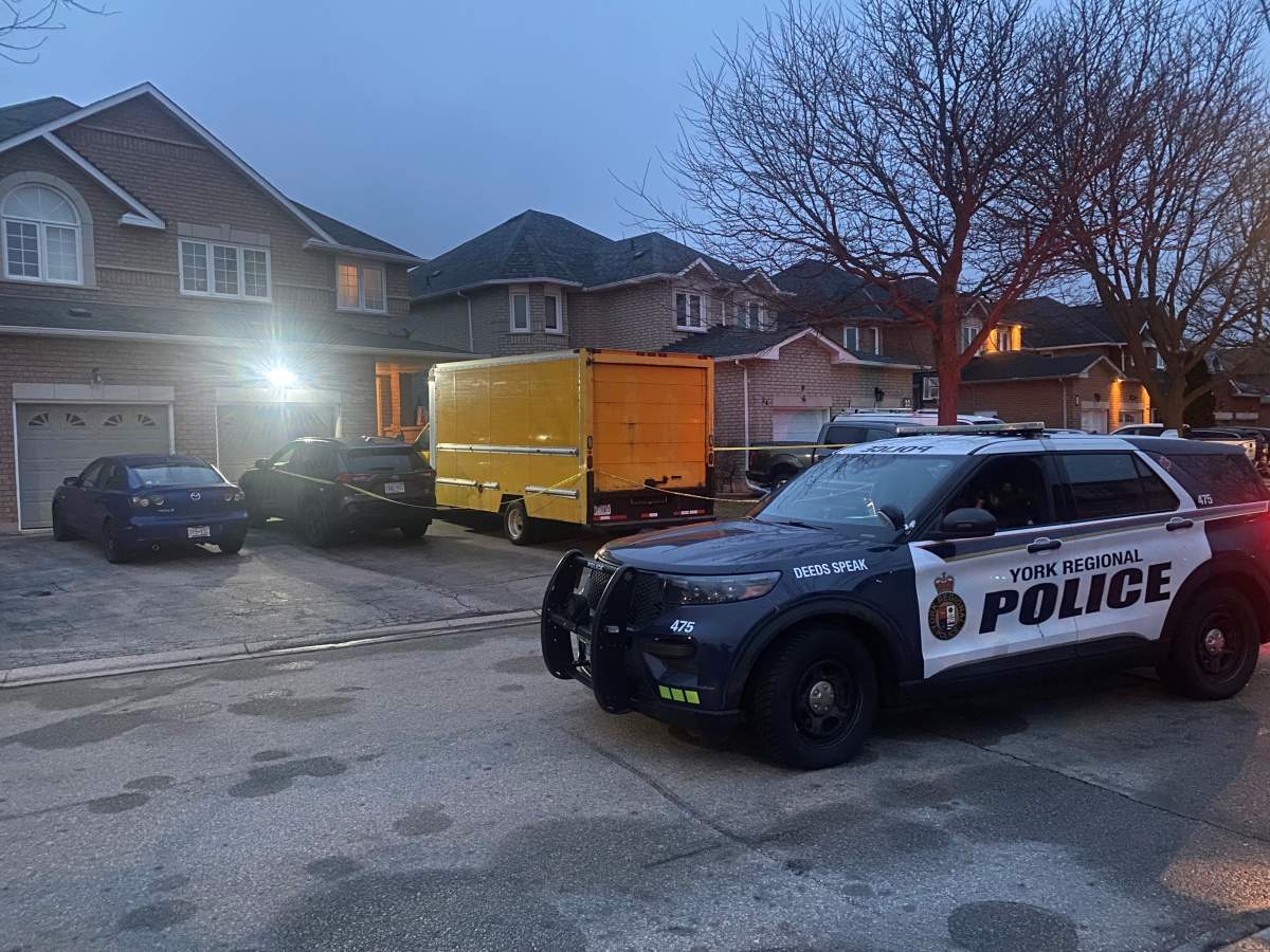 Police outside of a Woodbridge, Ont. home on March 6, 2024.