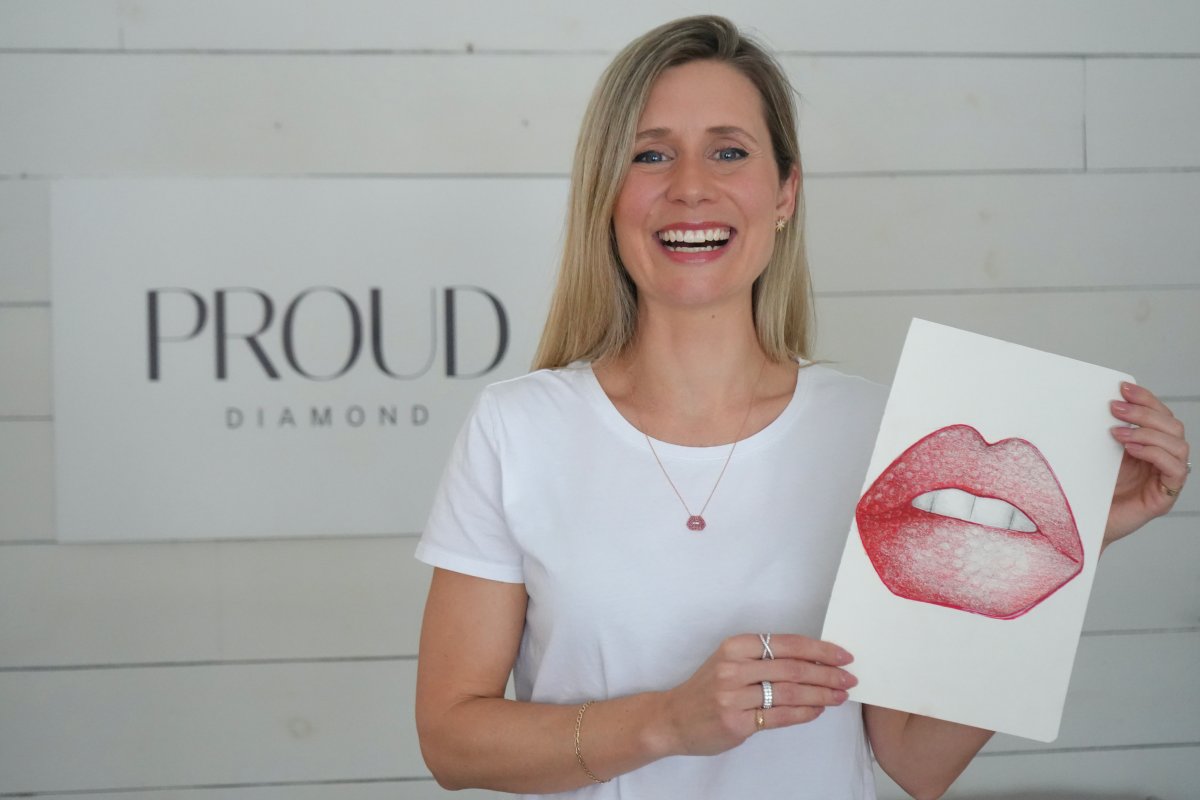 Virginie Roy wears a sketch of the creation for Taylor Swift, based on her iconic red lips.