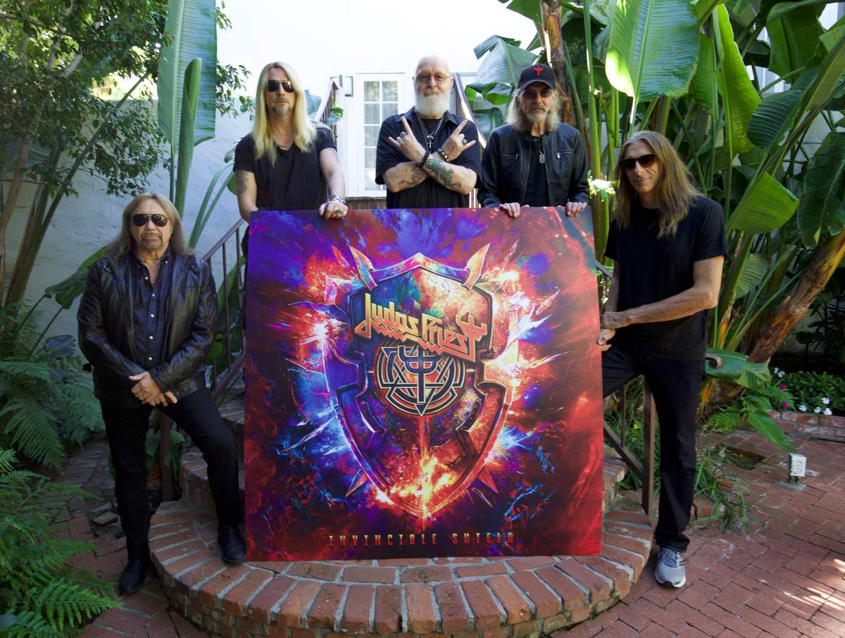 Judas Priest, the band, with an image if their 19th studio album ‘Invincible Shield’ (2024).