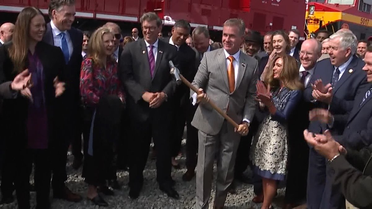 CPKC CEO Keith Creel takes part in a ceremonial driving of the last spike in April 2023 celebrating the merger of Canadian Pacific with Kansas City Southern.