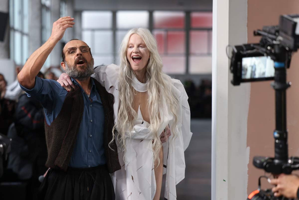 Designer Andreas Kronthaler, left, and Kristen McMenamy accept applause after the Vivienne Westwood Fall/Winter 2024-2025 ready-to-wear collection presented Saturday, March 2, 2024 in Paris.