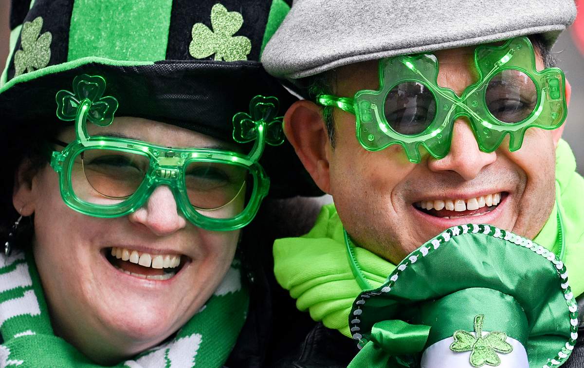 Members of the crowd look on as they enjoy the St. PatrickÕs Day parade in Montreal, Sunday, March 17, 2024. THE CANADIAN PRESS/Graham Hughes