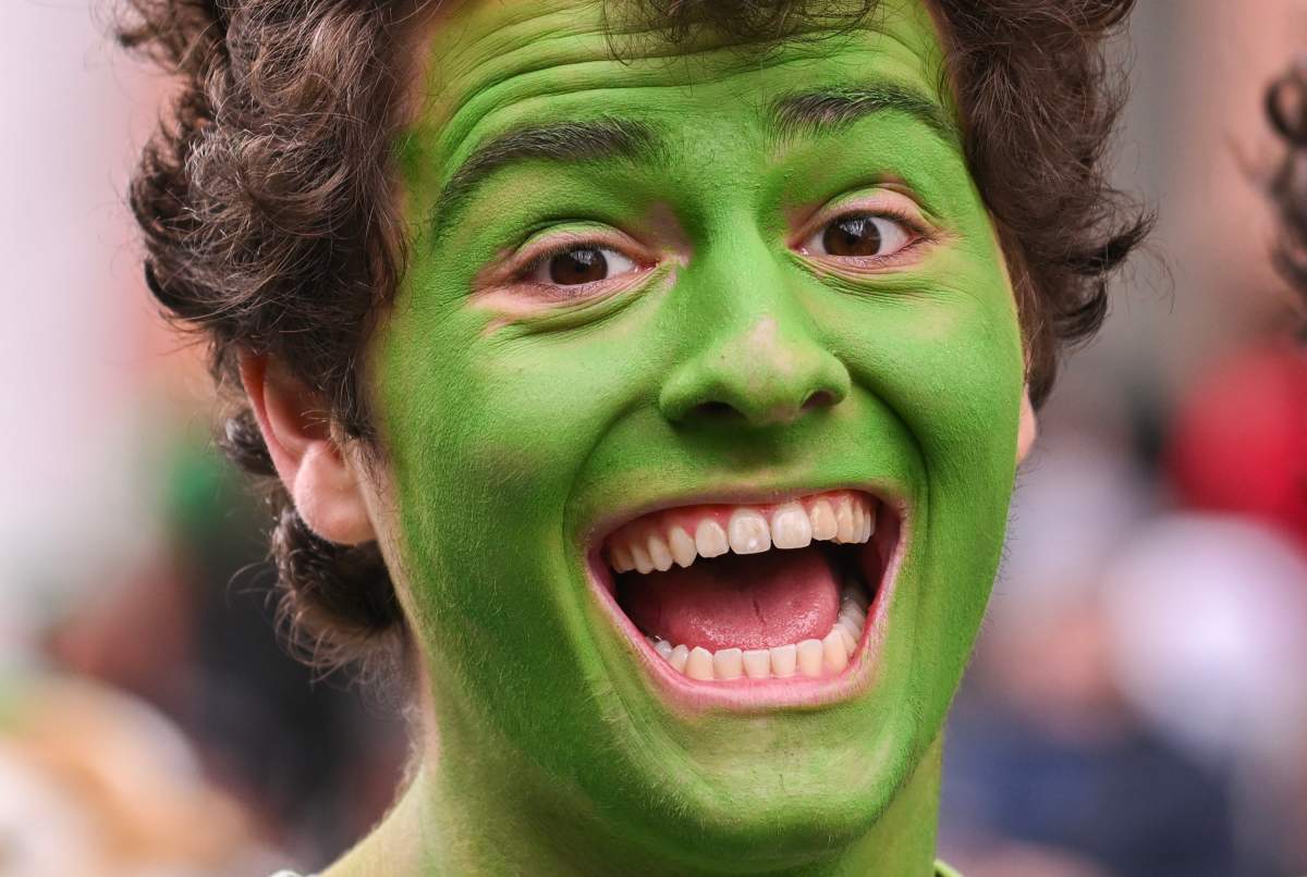 A participant smiles during the St. Patrick’s Day parade in Montreal, Sunday, March 17, 2024. THE CANADIAN PRESS/Graham Hughes