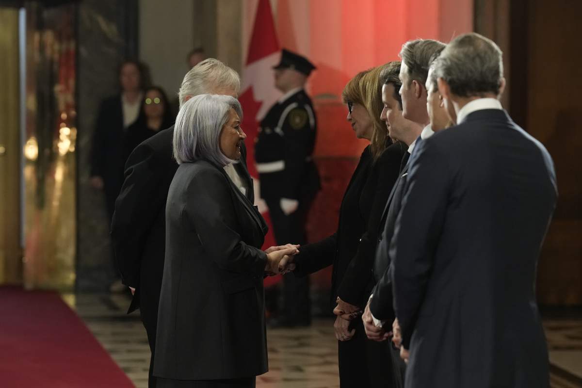 Gov. Gen. Mary Simon speaks to the Mulroney family.