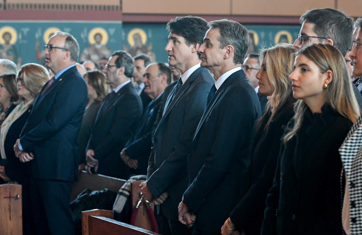 Prime Minister Justin Trudeau, centre left, and Prime Minister of Greece Kyriakos Mitsotakis, centre right, attend a mass at the Theotokou Greek Orthodox Church in Montreal, Sunday, March 24, 2024. THE CANADIAN PRESS/Graham Hughes