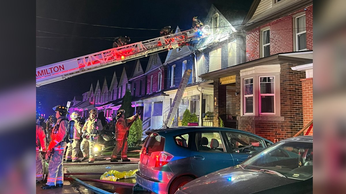 Fire fighters seen battling a multiple alarm blaze at a home on Dalkeith Avenue in Hamilton, Ont. March 19, 2024. Two people had to be rescued from a burning home, according to investigators.