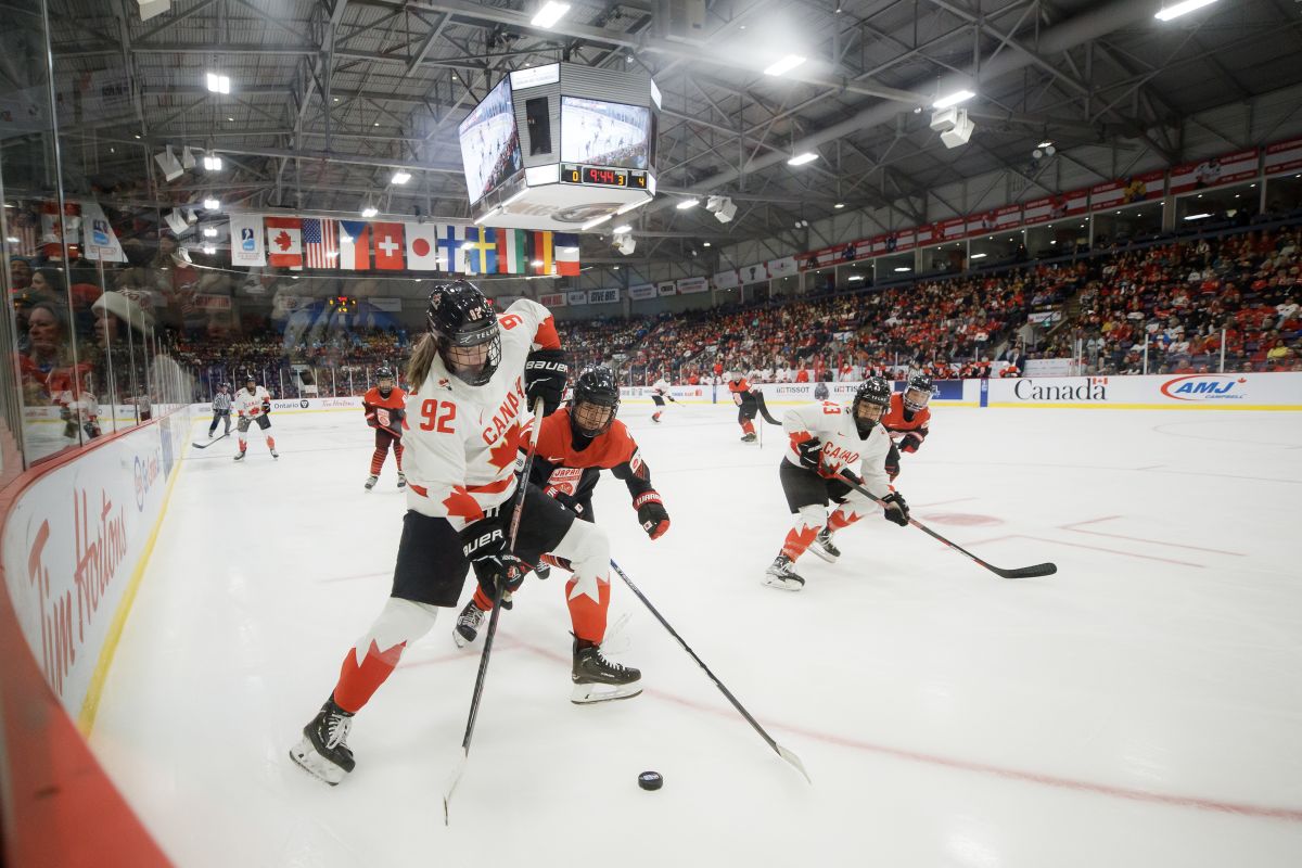 Canada forward Danielle Serdachny (92) and Japan defender Kanami Seki (7) battle for the puck during third period IIHF WomenÕs World Hockey Championship hockey action in Brampton, Ont., on Saturday, April 8, 2023.