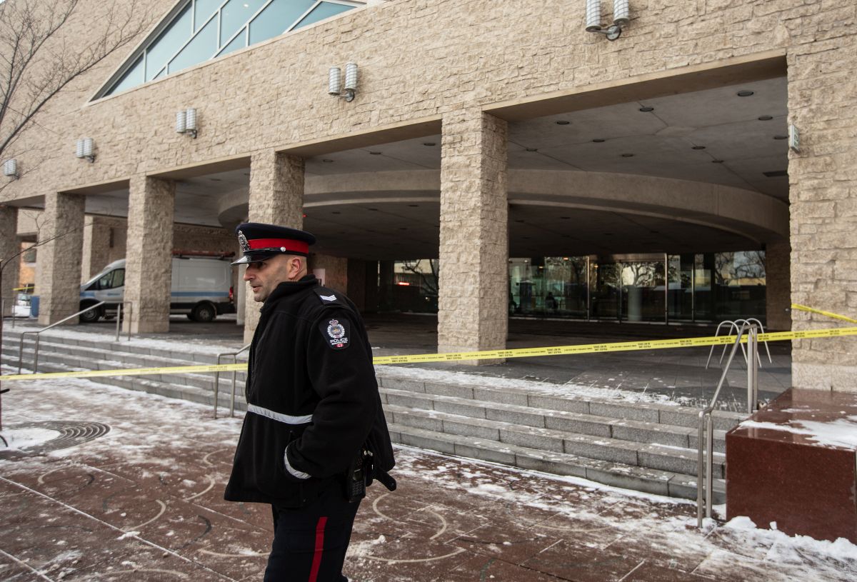 Edmonton Police were investigating a shooting Tuesday at City Hall, where a Molotov cocktail was also thrown from the building's second floor. A police officer is seen at City Hall during an investigation, in Edmonton, Tuesday, Jan. 23, 2024.