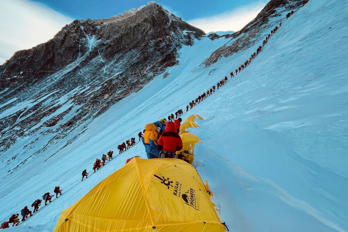 A row of climbers along Mount Everest.
