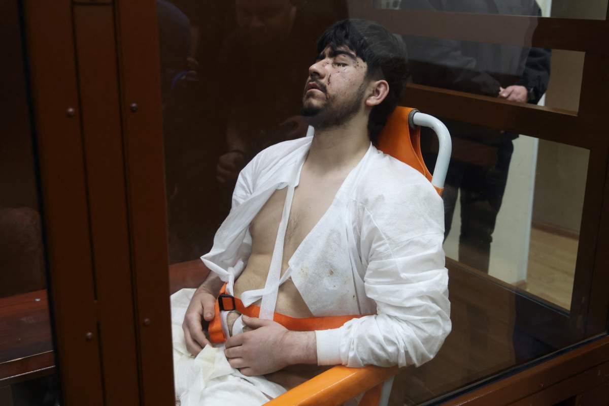 Mukhammadsobir Faizov appears unconscious as he appears in Moscow court.
