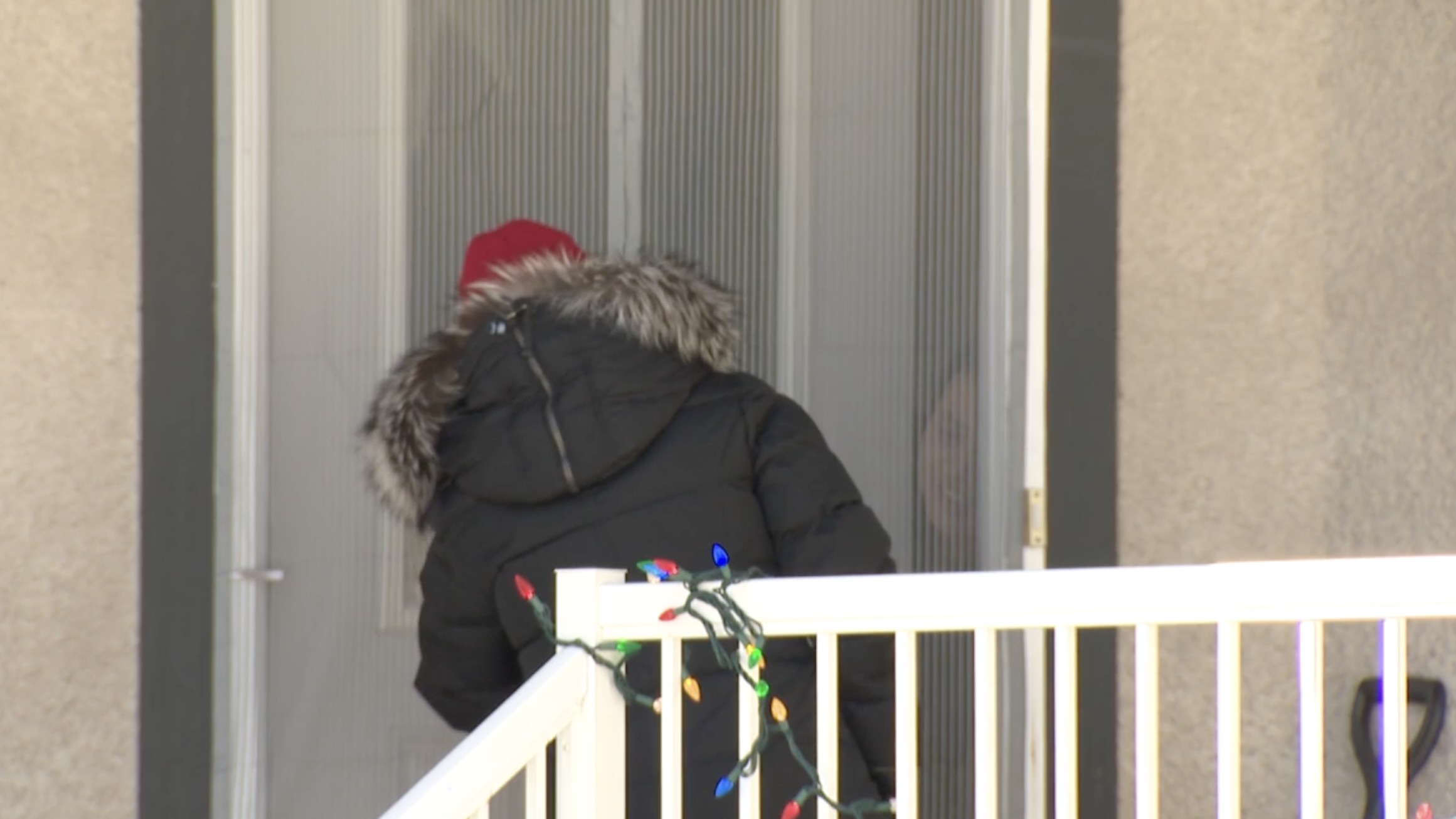 Former PLA member Huajie Xu answers door of a Winnipeg house fitted with CCTV cameras.