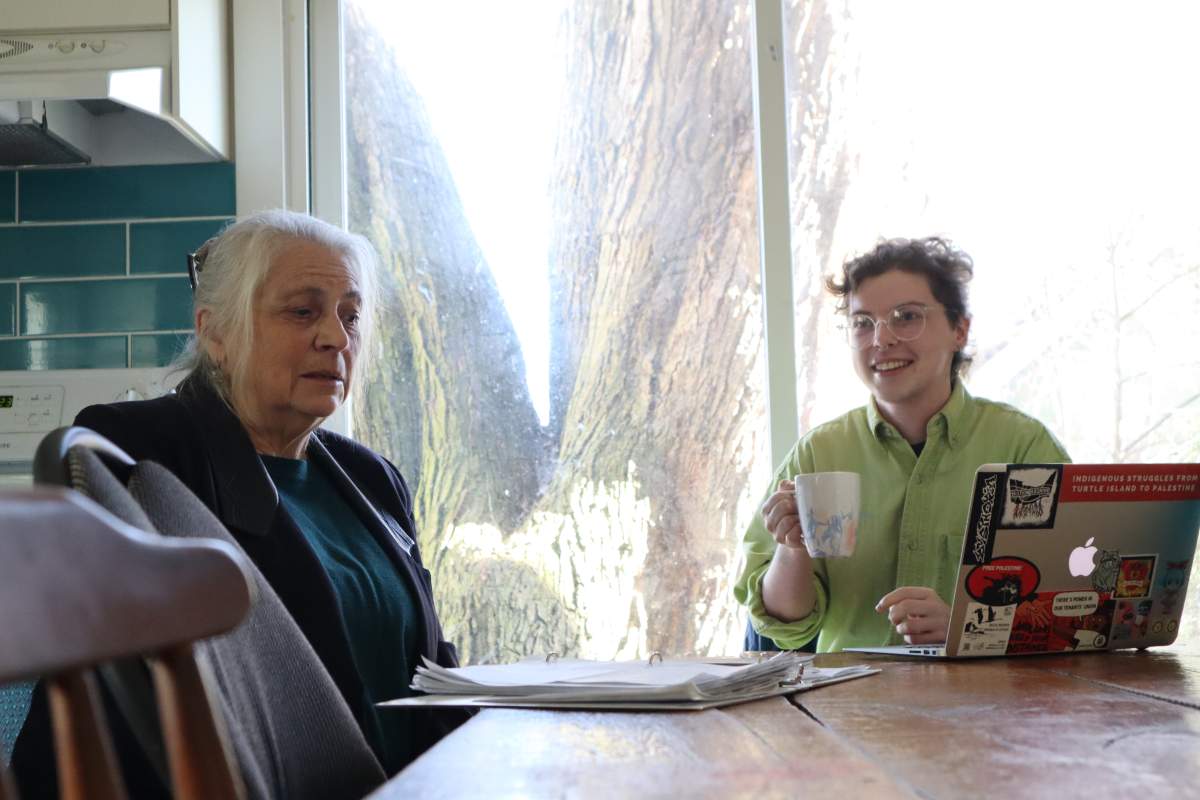 Tara Kainer (left) with Just Recovery Kingston speaks about a recent survey collecting the shared experiences of local renters.