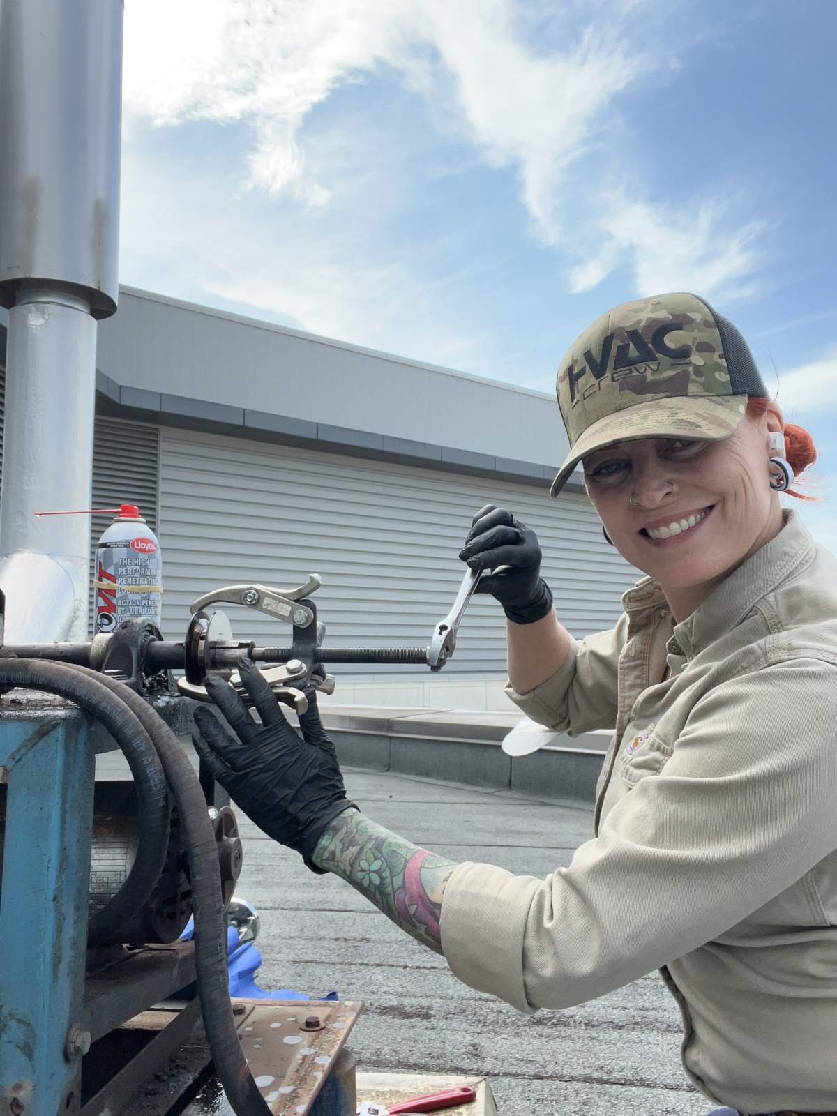Brandi Ferenc, a journeyperson, working as an HVAC mechanic.