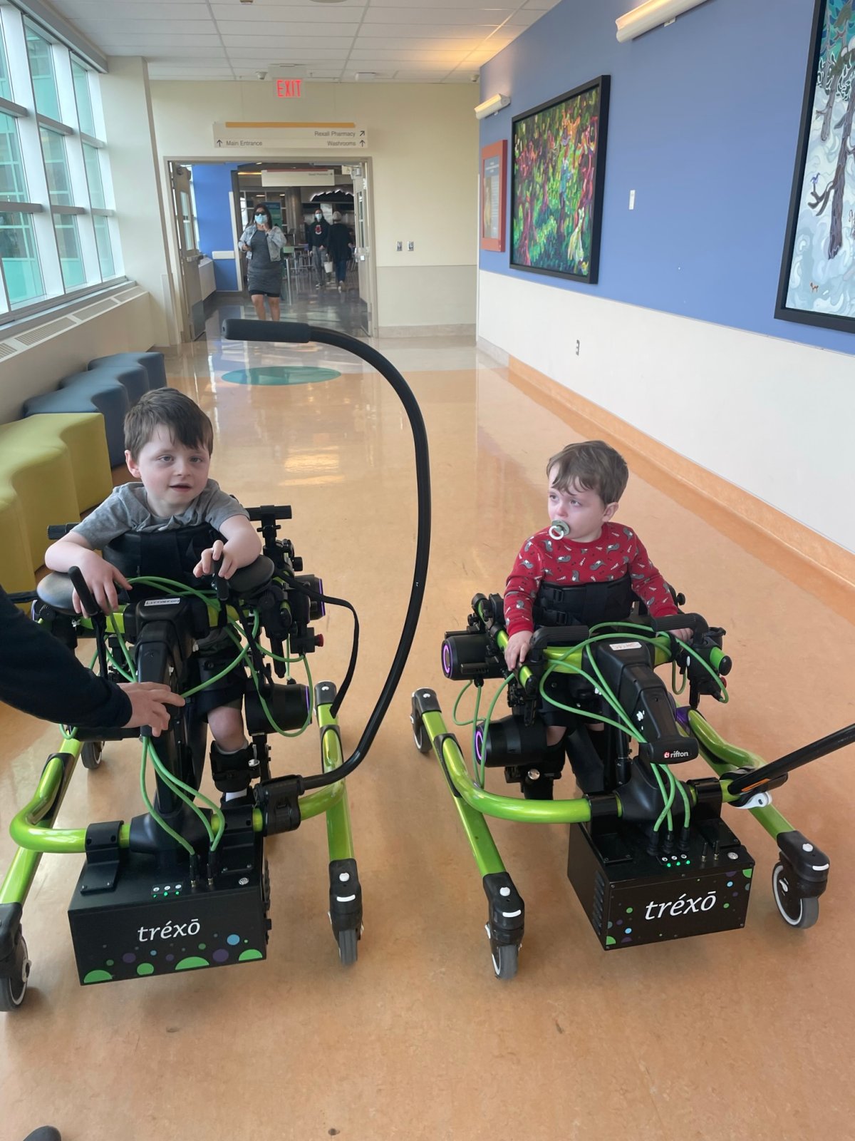 File photo of Alberta children Jaxson and Joseph trying out a Trexo Walker at the Alberta Children’s Hospital in Calgary.