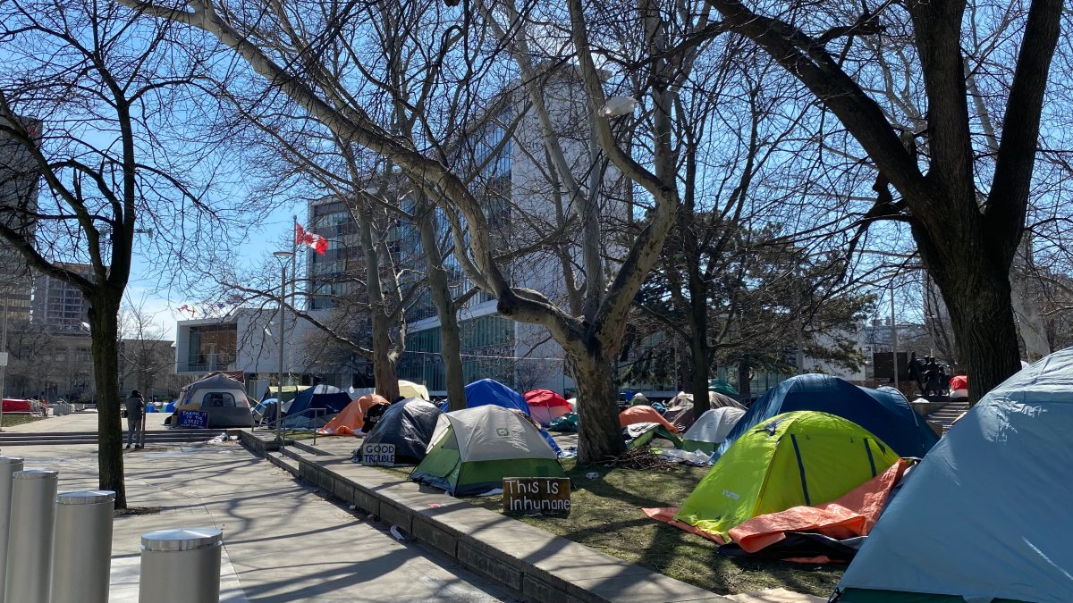 Photo of some 40 tents in the forecourt at city hall in Hamilton, Ont. on March 25, 2024