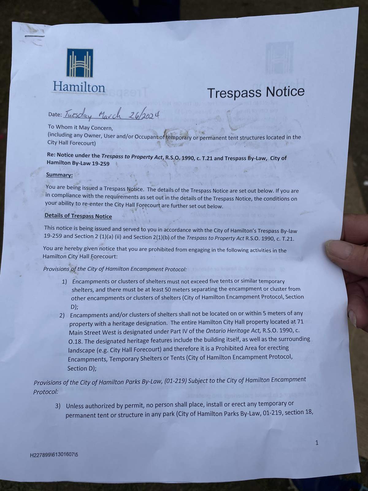 Photo of a trespass notice issued Mar. 26, 2024 to the occupants of some 40 tents in the forecourt of city Hall in Hamilton Ont.