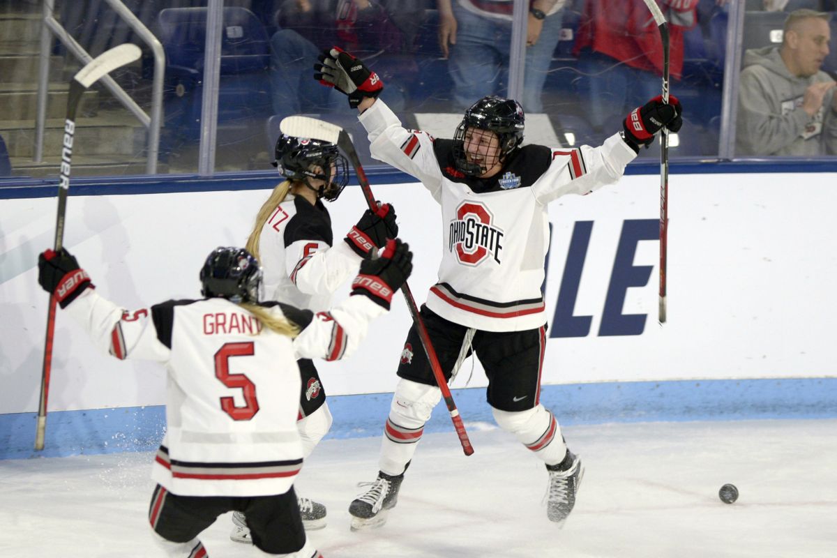 Ohio State's Jennifer Gardiner, right, celebrates with teammates Teagan Grant (5) and Hadley Hartmetz (6) after scoring during the second period of an NCAA college women's Frozen Four semifinal hockey game against Yale Friday, March 18, 2022, in State College, Pa.