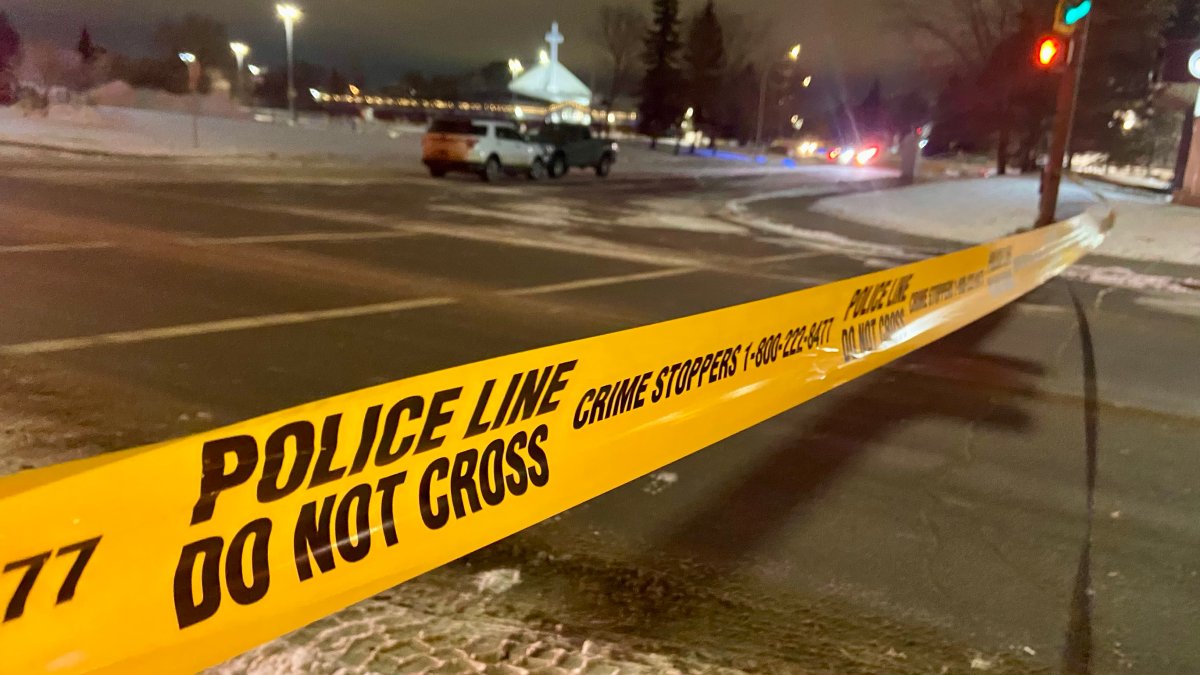 Two vehicles on 98A Avenue near 178 Street behind police tape in west Edmonton on Friday, March 1, 2024.