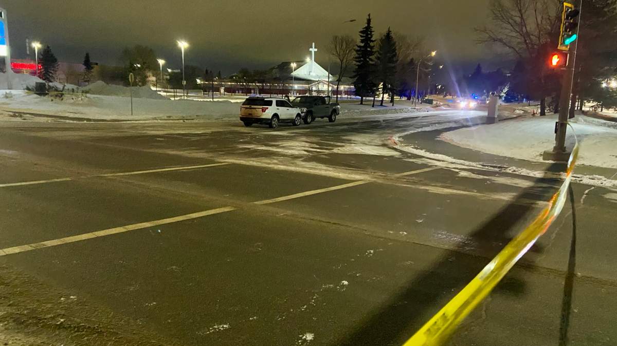 Two vehicles on 98A Avenue near 178 Street behind police tape in west Edmonton on Friday, March 1, 2024.