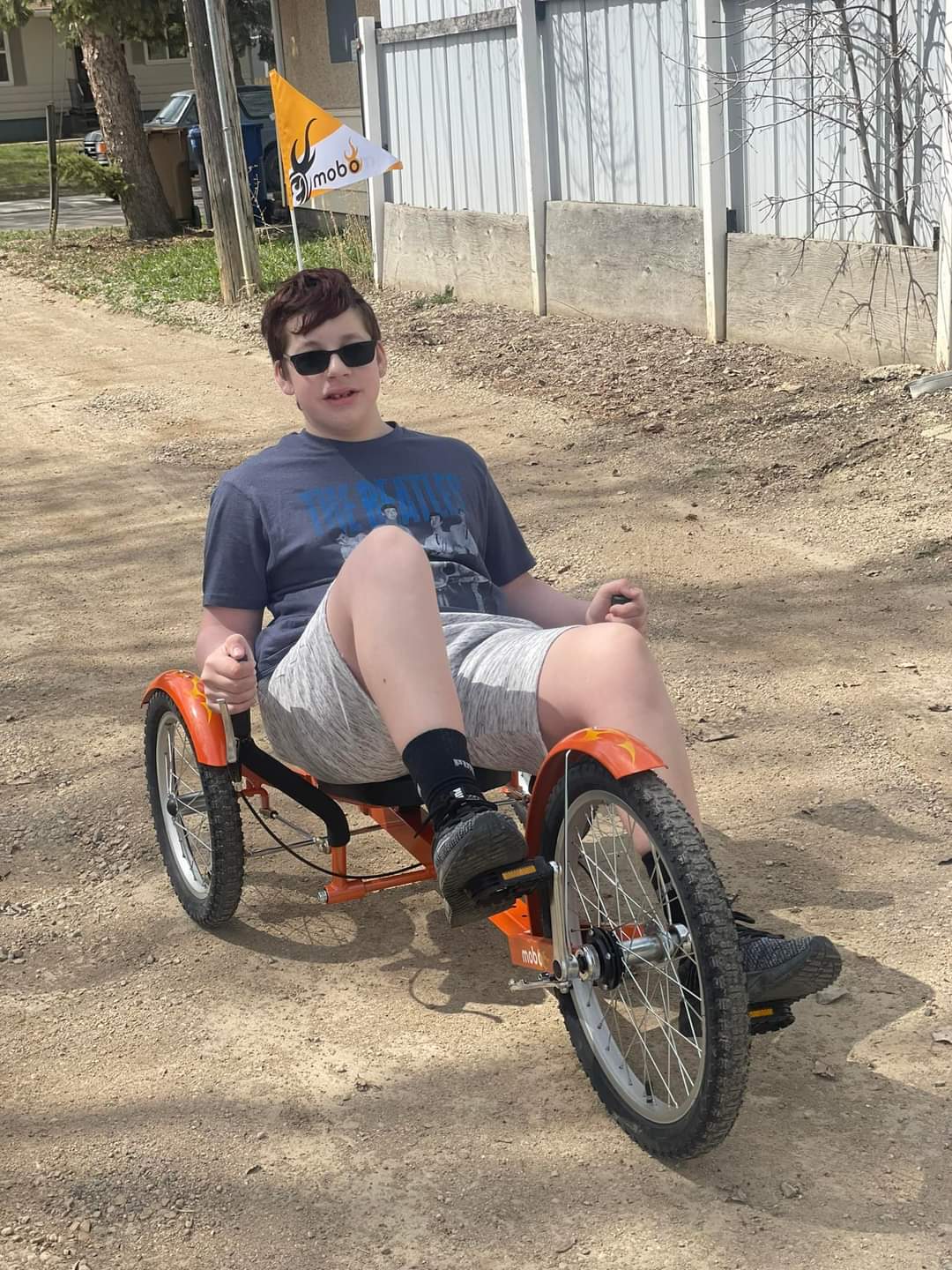 Kim Barrington's son and his special needs bike that was stolen.