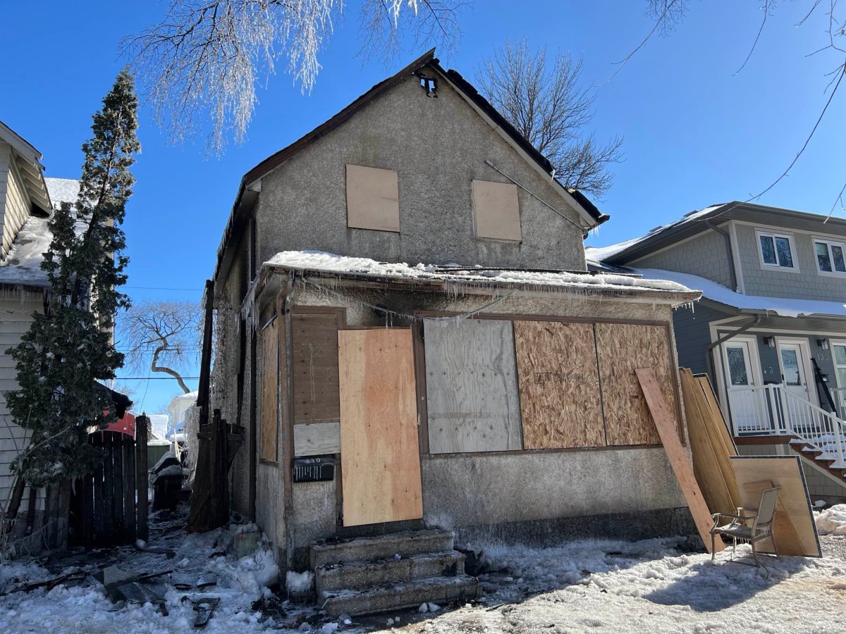 Photo of the home damaged by a fire in the 100 block of Hallet Street in Winnipeg on Saturday.