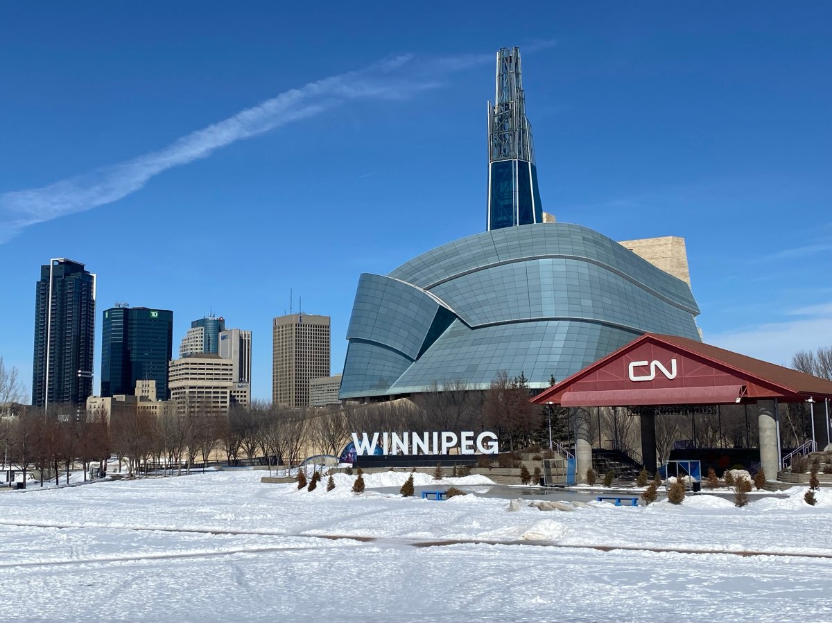 The Canadian Museum for Human Rights, the Winnipeg sign, and the downtown skyline are all seen from The Forks. 