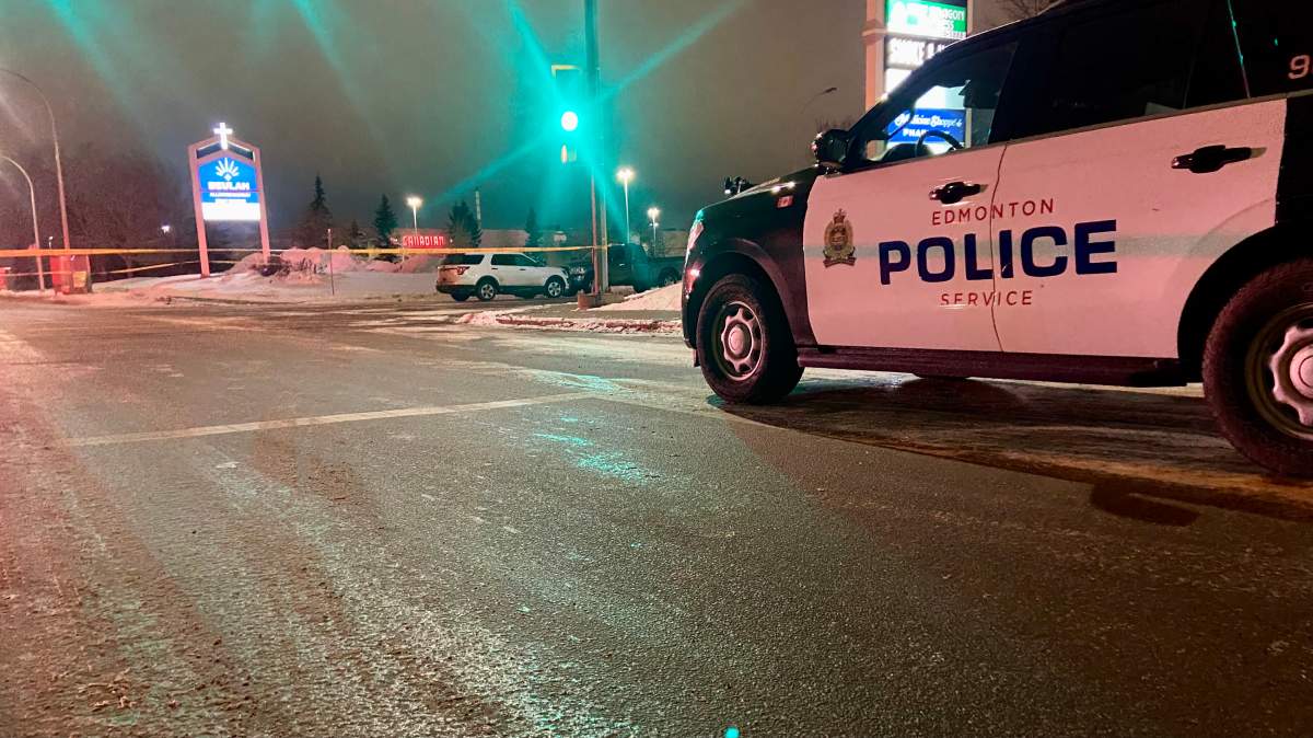 Two vehicles on 98A Avenue near 178 Street behind police tape in west Edmonton on Friday, March 1, 2024.