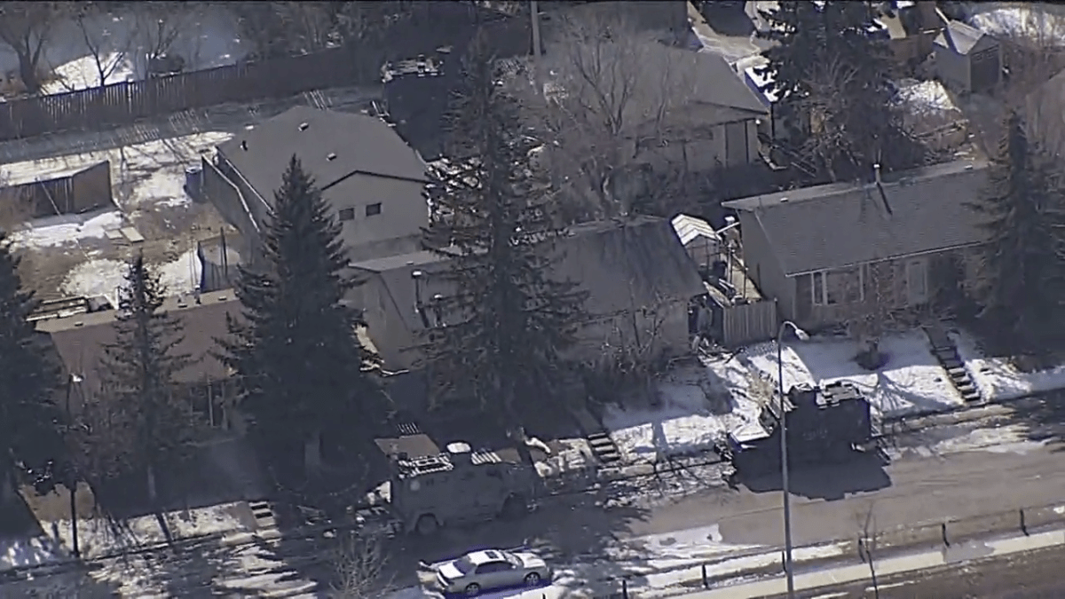 Three armoured police vehicles are pictured outside a Penbrooke Meadows home on March 15, 2024.