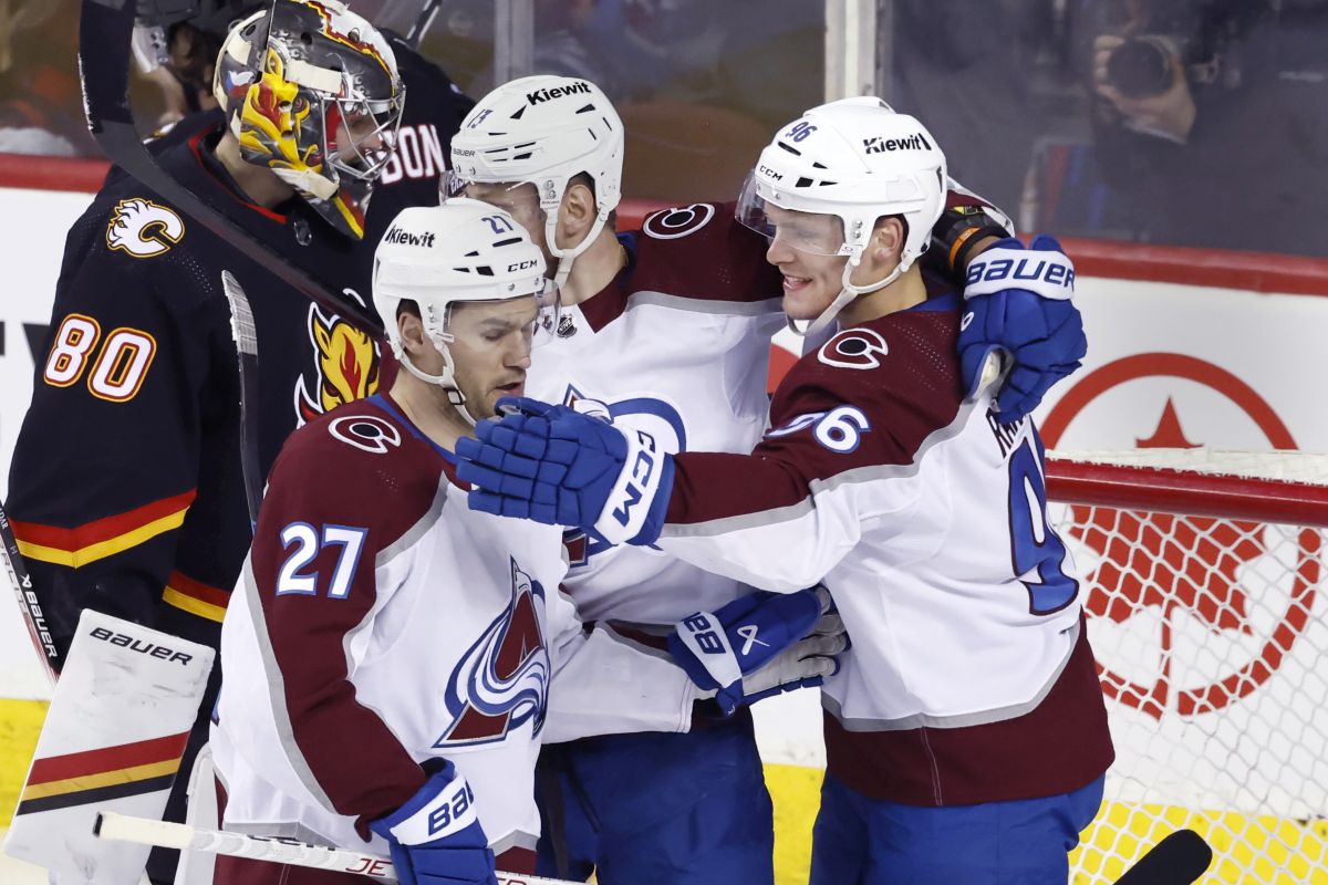 Colorado Avalanche's Mikko Rantanen, right. celebrates his goal against the Calgary Flames with Jonathan Drouin during first period NHL hockey action in Calgary, Tuesday, March 12, 2024.