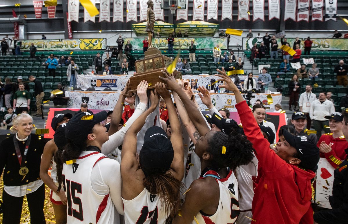 Carleton Ravens celebrate the win over the University of Saskatchewan Huskies during the U Sports Women's Final Basketball Championship, in Edmonton, Sunday, March 10, 2024.