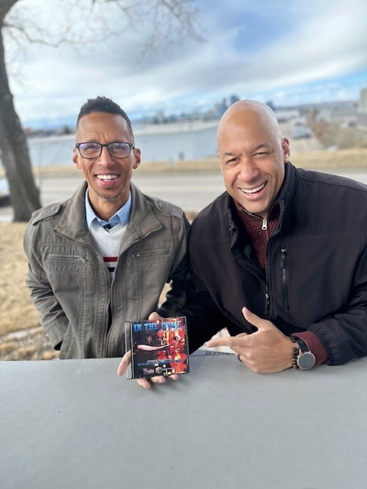 Brendon Sanguinetti (a.k.a. Don Getti) and Drew Allum (a.k.a. Drew Atlas) with a CD of their song "In 'Da Dome," written during the Flames' 2004 Stanley Cup run.