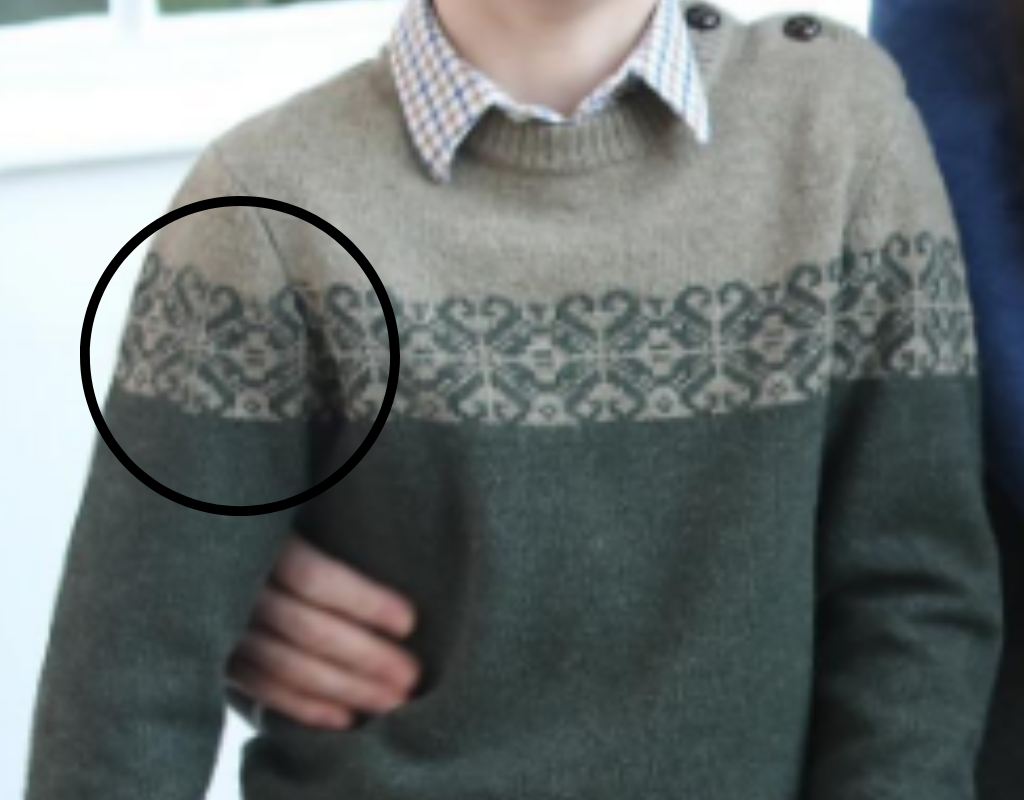 A lose-up of Louis' sweater.