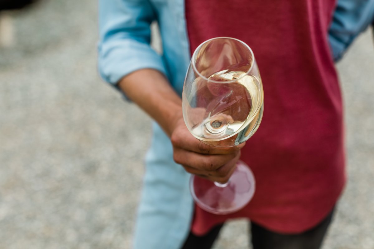 A person holding a glass of wine.